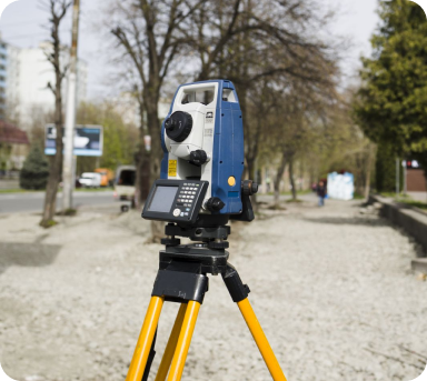surveyor-holding-digital-level-with-construction-site-background