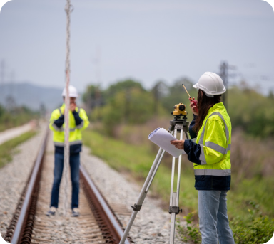 surveyors-working-with-digital-level-using-tablet-field 1